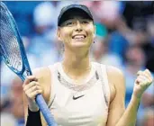  ?? AL BELLO/GETTY ?? Maria Sharapova celebrates after rallying to beat Timea Babos in three sets during the second round Wednesday.