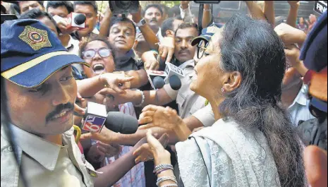  ?? BHUSHAN KOYANDE/HT PHOTO ?? Supriya Sule tries to pacify the agitating MSRTC employees outside Sharad Pawar’s residence on Friday.