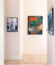  ??  ?? 8
Danny Heller’s Self-Portrait
#1, 2015, oil on canvas, is on the left. He can be seen in a reflection in the window taking the photo of a house in Paris. On the right is Atelier 1, 1975, oil on canvas, by André Minaux (1923-1986).