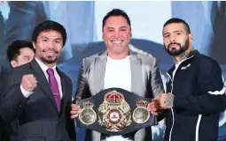  ?? (Contribute­d photo by Wendell Alinea) ?? PRE-FIGHT APPEARANCE – Boxing great Oscar De La Hoya holds the special WBA that will be stake when Manny Pacquiao (left) and Lucas Matthysee clash in the ring in Kuala Lumpur, Malaysia, on Sunday.