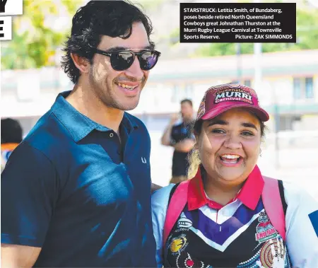  ?? STARSTRUCK: Letitia Smith, of Bundaberg, poses beside retired North Queensland Cowboys great Johnathan Thurston at the Murri Rugby League Carnival at Townsville Sports Reserve. Picture: ZAK SIMMONDS ??