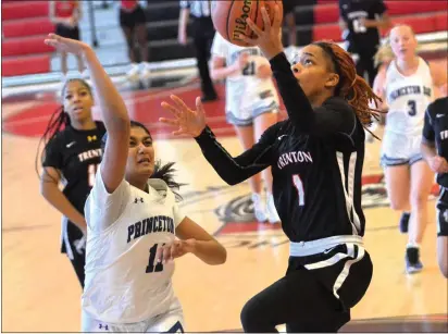  ?? KYLE FRANKO — TRENTONIAN PHOTO ?? Trenton’s Ji’Asia Robinson, right, lays the ball in the basket ahead of the defense of Princeton Day’s Nandini Kolli, left, during a CVC girls basketball game on Thursday afternoon at Tornado Alley in Trenton.