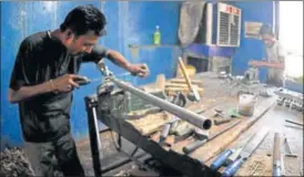  ?? NITIN KANOTRA/HT ?? A worker making a gun at a factory in Jammu. The Indian government banned civilian firearms licenses in early 1990s in Kashmir valley when an armed rebellion broke out against Indian rule.