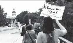  ?? KIM HAIRSTON/BALTIMORE SUN ?? Tenants and advocates march from Annapolis District Court to the Governor’s Mansion to urge Gov. Larry Hogan to protect renters in Maryland from eviction in June 2020.