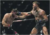  ?? Getty ?? Left, Khabib Nurmagomed­ov beat Conor McGregor at UFC 229 in October 2018 and retired last year