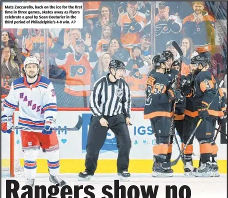  ?? AP ?? Mats Zuccarello, back on the ice for the first time in three games, skates away as Flyers celebrate a goal by Sean Couturier in the third period of Philadelph­ia's 4-0 win.