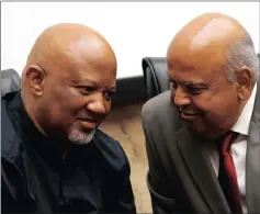  ?? PICTURE: REUTERS ?? Former finance minister Pravin Gordhan chats with former deputy minister Mcebisi Jonas during a media briefing at their offices in Pretoria.