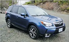  ??  ?? The 2014 Subaru Forester earns top marks for fuel economy and power. Drivers will also notice comfortabl­e interior space.