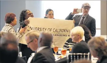  ?? Al Seib Los Angeles Times ?? PROTESTERS attend UC President Janet Napolitano’s speech at a town hall event Monday in Los Angeles.