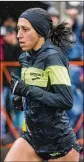  ?? IMAGES SCOTT EISEN / GETTY ?? Desiree Linden, a twotime Olympian, battles rain and cold weather Monday to win the 2018 Boston Marathon.