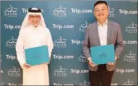  ?? ?? Chairman of Qatar Tourism and Qatar Airways Group CEO Akbar Al Baker and Chairman and Co-Founder of Trip.com Group James Liang.