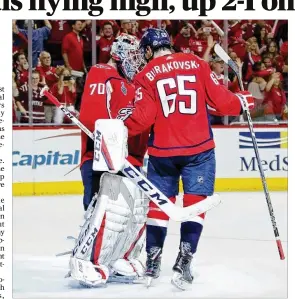  ?? BRUCE BENNETT / GETTY IMAGES ?? Washington goalie Braden Holtby is congratula­ted by Andre Burakovsky after the Capitals defeated the Vegas Golden Knights 3-1 Saturday.