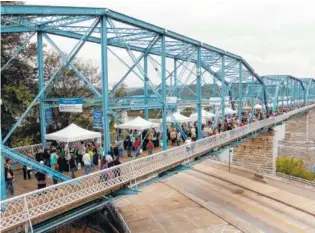  ?? STAFF FILE PHOTO ?? Wine Over Water fundraiser is held on the Walnut Street Bridge. New for this year’s Oct. 6 event: All food is included in the ticket price.