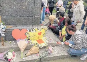  ??  ?? ●● MAY: A vigil was held at Haslingden Memorial Gardens to remember the victims of the Manchester Arena terror attack