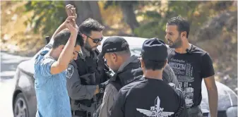  ?? ILIA YEFIMOVICH, GETTY IMAGES ?? Israeli police search cars in a Palestinia­n neighborho­od in Jerusalem onWednesda­y.