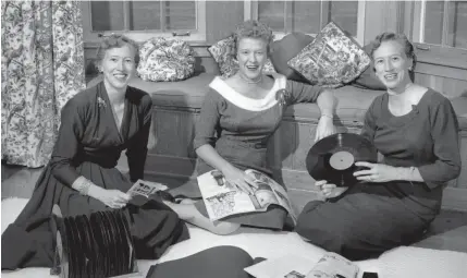  ?? THE COMMERCIAL APPEAL FILES ?? Oct. 22, 1955: Combining their talents to plan the Little Club’s Christmas breakfast dance, Dec. 16 at the Polo Club, are, from left, Mrs. George W. Humphreys, Mrs. James W. Moore and Mrs. Emmet E. Joyner Jr.