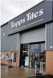  ??  ?? Welcome The Topps Tiles premises on the Inveralmon­d Industrial Estate