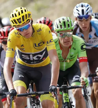  ??  ?? Chris Froome awaits the start of the Marseille time trial that would s e a l h i s To u r t r i u m p h 02 LEFT
Froome, Rigoberto Uran and Romain Bardet would go into that time trial separated by less than 30 seconds