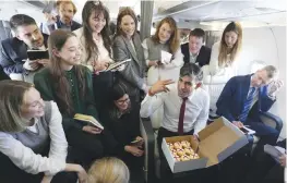  ?? —AP ?? Britain’s Prime Minister Rishi Sunak speaks to journalist­s on board his special aircraft on the way to Warsaw’s Chopin airport in Poland on Tuesday.