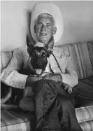  ??  ?? Owner Lee Duncan holding Rin Tin Tin. Photograph: Bill Bridges/The Life Images Collection via Getty Images