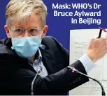  ??  ?? Mask: WHO’s Dr Bruce Aylward in Beijing