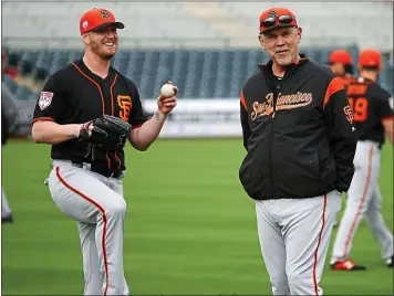  ?? KARL MONDON — STAFF PHOTOGRAPH­ER ?? Manager Bruce Bochy indicated Will Smith, left, the team’s closer last season, will have competitio­n this spring.