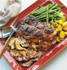  ?? MIA VIA THE ASSOCIATED PRESS ?? Pork shoulder is super-tender if you cook it at low temperatur­e for several hours.