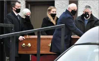  ??  ?? In the first of two separate funeral services, the remains of Patrick Hennessy are removed from the church in Mitchelsto­wn on Wednesday; the funeral of his brothers, Willie and Paddy, take place today, Thursday.