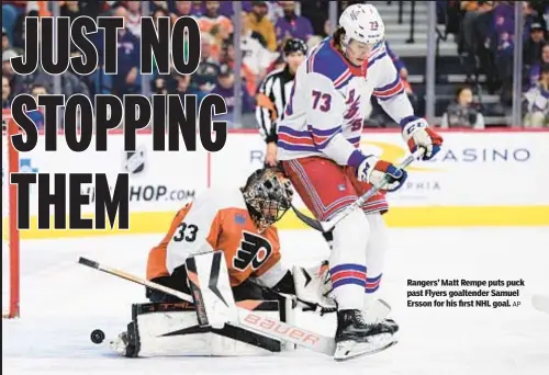  ?? AP ?? Rangers’ Matt Rempe puts puck past Flyers goaltender Samuel Ersson for his first NHL goal.