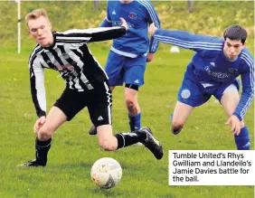  ??  ?? Tumble United’s Rhys Gwilliam and Llandeilo’s Jamie Davies battle for the ball.