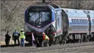  ?? THE ASSOCIATED PRESS ?? Amtrak investigat­ors inspect a deadly train crash April 3, 2016, in Chester, Pa.