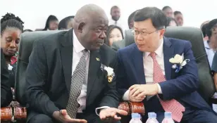  ?? Picture: Charles Muchakagar­a - ?? Primary and Secondary Education Minister Torerayi Moyo (left) and Chinese Ambassador to Zimbabwe Zhou Ding chat during the China-Zimbabwe Cultural Exchange programme in Harare yesterday.