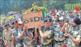  ?? NITIN KANOTRA /HT ?? Officials of the Border Security Force carrying the coffin of constable Brijendra Bahadur Singh in Jammu on Friday.