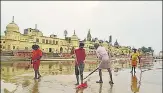  ?? PTI ?? Workers clean Ram Ki Pauri ahead of the foundation-laying n ceremony of Ram temple in Ayodhya on Monday.