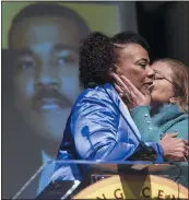  ?? JOHN BAZEMORE — THE ASSOCIATED PRESS ?? Bernice King, daughter of civil rights leader Martin Luther King Jr., left, gets a kiss from Alveda King a she speaks about her brother Dexter Scott King during a news conference Tuesday in Atlanta.