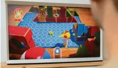 ?? Fotos (3): Andrea Warnecke, dpa ?? Nostalgie pur: Zum Spiele-Katalog von Apple Arcade – hier auf einem Fernseher – gehört eine Neuauflage von Klassikern wie „Frogger“.
