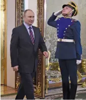  ?? — AFP ?? Russian President Vladimir Putin enters a hall at the Kremlin in Moscow on Thursday.