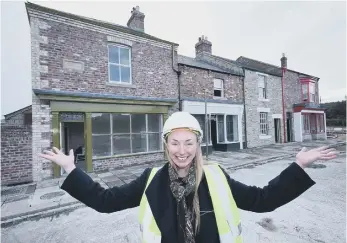  ?? ?? Helen Barker, assistant director for Remaking Beamish, prepares to welcome vistors to the new 1950s terrace.