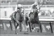  ?? Jae C. Hong Associated Press ?? ARROGATE, left, comes from behind to defeat California Chrome in the Breeders’ Cup Classic.