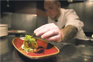  ?? Richard Ross / Getty Images ?? Take a tip from the restaurant chefs who take time for a final touch. Below, oil, infused with citrus zest and a spice blend, enhances your meals.