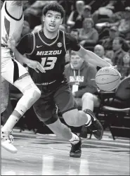  ?? AP/MICHAEL WOODS ?? Missouri guard Mark Smith (13) might miss tonight’s game against Arkansas with an injured ankle. Smith has not played since Jan. 23 when he was hurt with 1:06 left in the Tigers’ 72-60 loss at Arkansas.