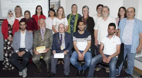  ??  ?? At the Refugee Resettleme­nt Programme family day celebratio­ns in Wexford Library, back; Alessar Alkhatib, Nuala Walsh, Zahira Alkasem, Fran Kennedy, Ingrid Arfa, Trish Barrett, Marian Mangaons, Sara Kelly, Margaret Stafford, Declan Doyle, Nicola...