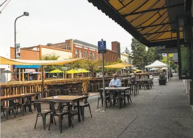  ?? Photos by Rachel Bujalski / Special to The Chronicle ?? Only a few diners were using the outdoor seating in downtown Santa Rosa on Wednesday.