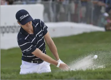  ?? JOHN STARKS — THE ASSOCIATED PRESS ?? Justin Thomas hits from the bunker on the 18th green during the first round of the BMW Championsh­ip at Medinah Country Club on Aug. 15 in Medinah, Ill.