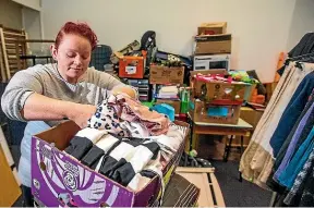  ?? DAVID UNWIN/STUFF ?? Women’s Refuge community advocate Chanelle Diemar sorts through donations.