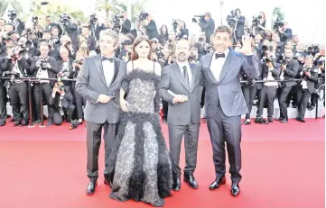  ??  ?? (From left) Darin, Cruz, Bardem and director Farhadi pose as they arrive on Tuesday for the screening of their film ‘Everybody Knows’ and the opening ceremony of the 71st edition of the Cannes festival. (Right) A general view taken on Tuesday shows the...