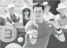  ?? GRAHAM HUGHES THE CANADIAN PRESS ?? Milos Raonic earned his first victory in Montreal since making it to the 2013 final with a 6-4, 6-4 win over France’s Lucas Pouille on Monday.