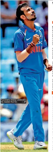  ?? — AP ?? Yuzvendra Chahal celebrates his maiden five- for.