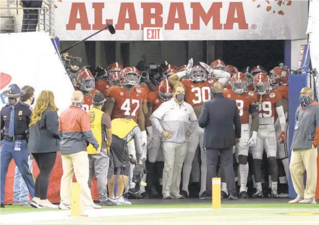  ?? AP ?? Nick Saban and his Crimson Tide wait to take field against Notre Dame in national semifinal a week ago and will be ready to go for the big prize tonight against Ohio State.