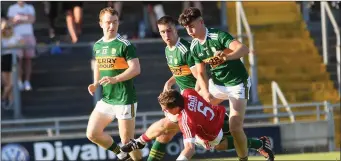  ??  ?? Cork defender Kevin Cremin comes under pressure from, from left, Thomas Hickey, Dan Daly and Lee Donoghue in the Munster Junior Football Championsh­ip Final in Austin Stack Park, Tralee .